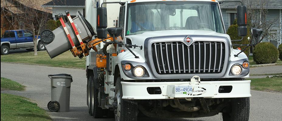 Garbage truck collecting garbage in Quesnel