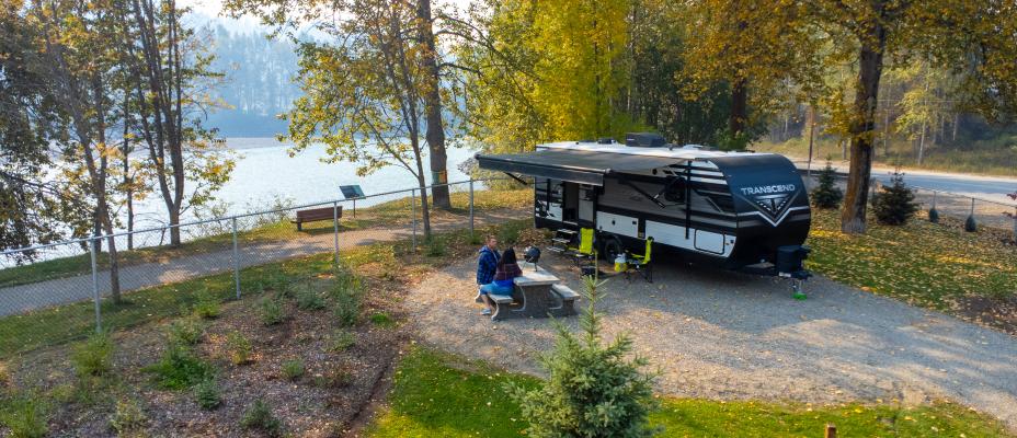Two people enjoying the Quesnel Downtown RV Park & Campground